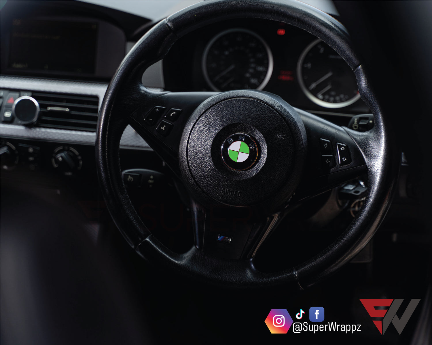 Ireland Flag BMW badge overlay on a steering wheel badge, close-up