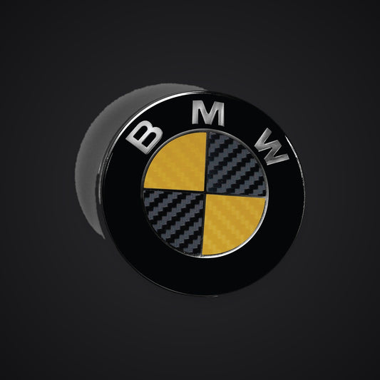 Black Yellow Carbon BMW badge overlay — SuperWrappz hero. Compatible with BMW — Not Genuine BMW Parts.