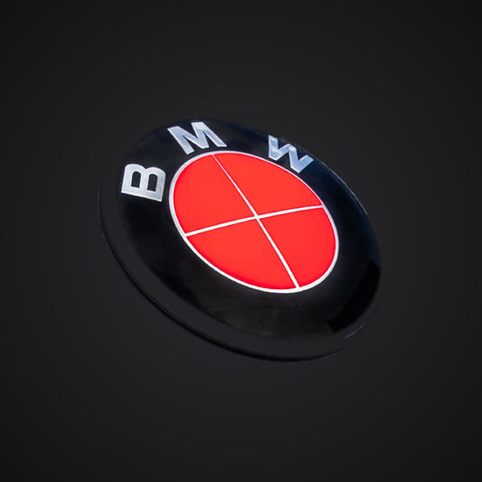 Full Red Fluorescent BMW badge overlay — SuperWrappz hero. Compatible with BMW — Not Genuine BMW Parts.