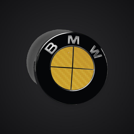 Full Yellow Carbon BMW badge overlay — SuperWrappz hero. Compatible with BMW — Not Genuine BMW Parts.