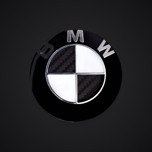 Half Black Carbon BMW badge overlay — SuperWrappz hero. Compatible with BMW — Not Genuine BMW Parts.