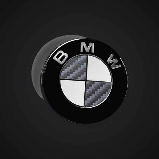 Half Dark Grey Carbon BMW badge overlay — SuperWrappz hero. Compatible with BMW — Not Genuine BMW Parts.