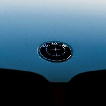 PATINA line card — BMW badge centered, wrapped-badge photo (recrop v4)