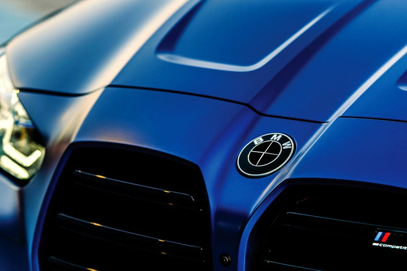 FORGE line card — blue G82 M4 with wrapped SuperWrappz badge. Compatible with BMW — Not Genuine BMW Parts.