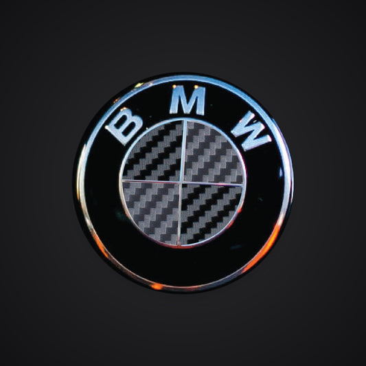 V2 Black Dark Grey Carbon F40 G20 G30 BMW badge overlay — SuperWrappz hero. Compatible with BMW — Not Genuine BMW Parts.