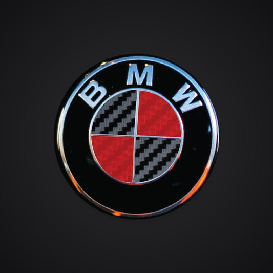 V2 Black Red Carbon BMW badge overlay — SuperWrappz hero. Compatible with BMW — Not Genuine BMW Parts.
