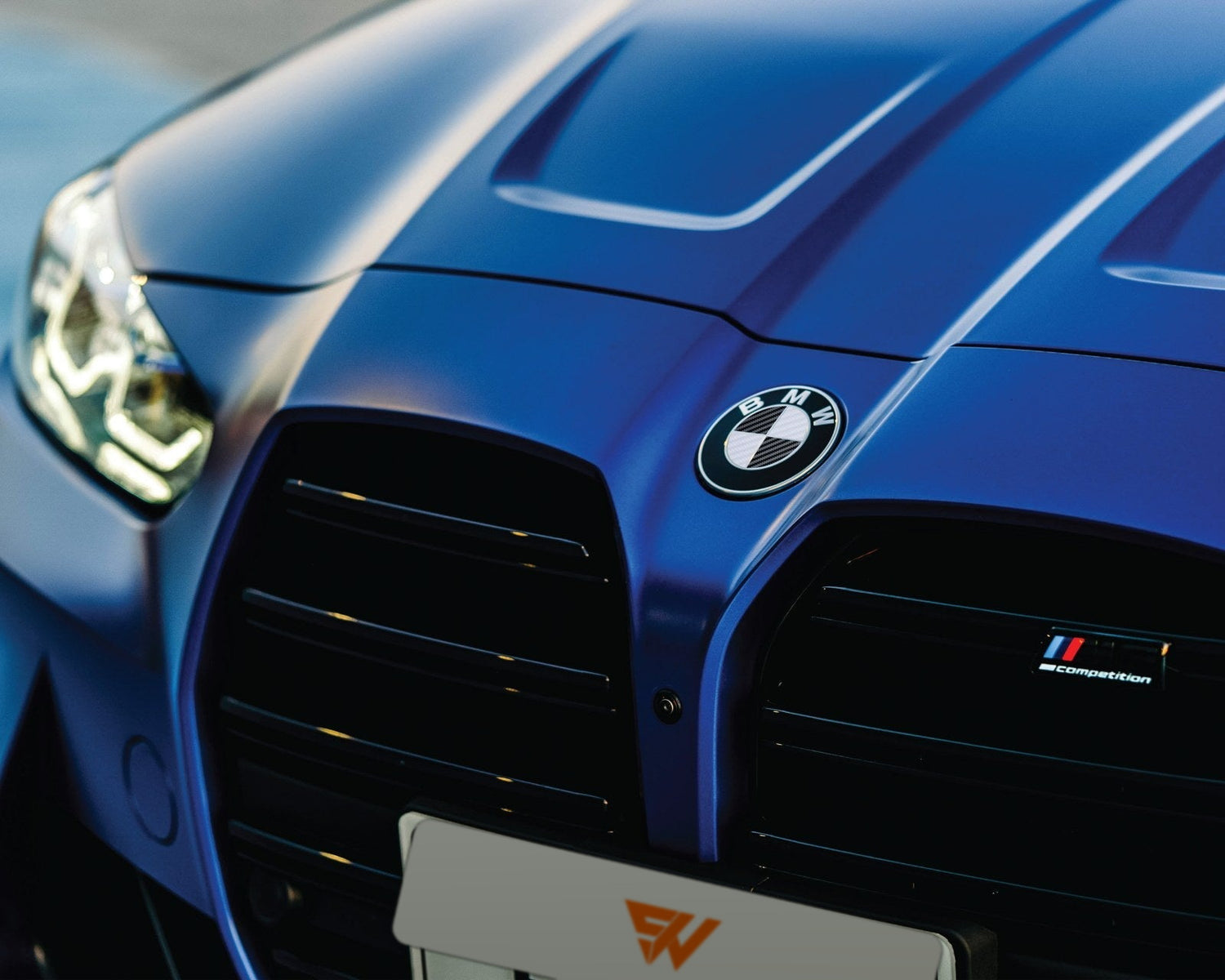 Black & White Carbon V2 BMW badge overlay on bonnet — compatible with F40, G20, G30