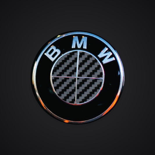 V2 Full Black Carbon BMW badge overlay — SuperWrappz hero. Compatible with BMW — Not Genuine BMW Parts.