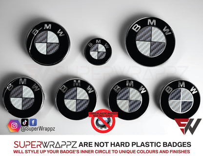 Dark Grey and Silver Carbon BMW badge overlay by SuperWrappz on E/F Series emblems, aftermarket cast-vinyl set