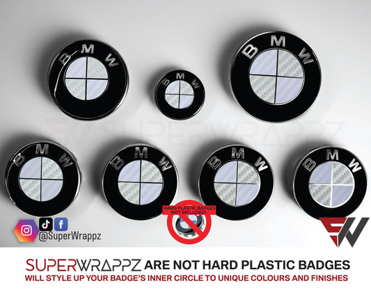 White and Silver Carbon BMW badge overlay by SuperWrappz on E/F Series emblems, aftermarket cast-vinyl set