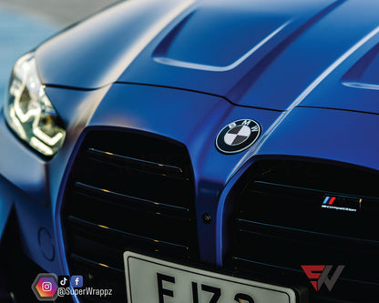 Black and White Carbon V2 BMW badge overlay by SuperWrappz for F40/G20/G30 2017-plus BMWs, aftermarket cast vinyl