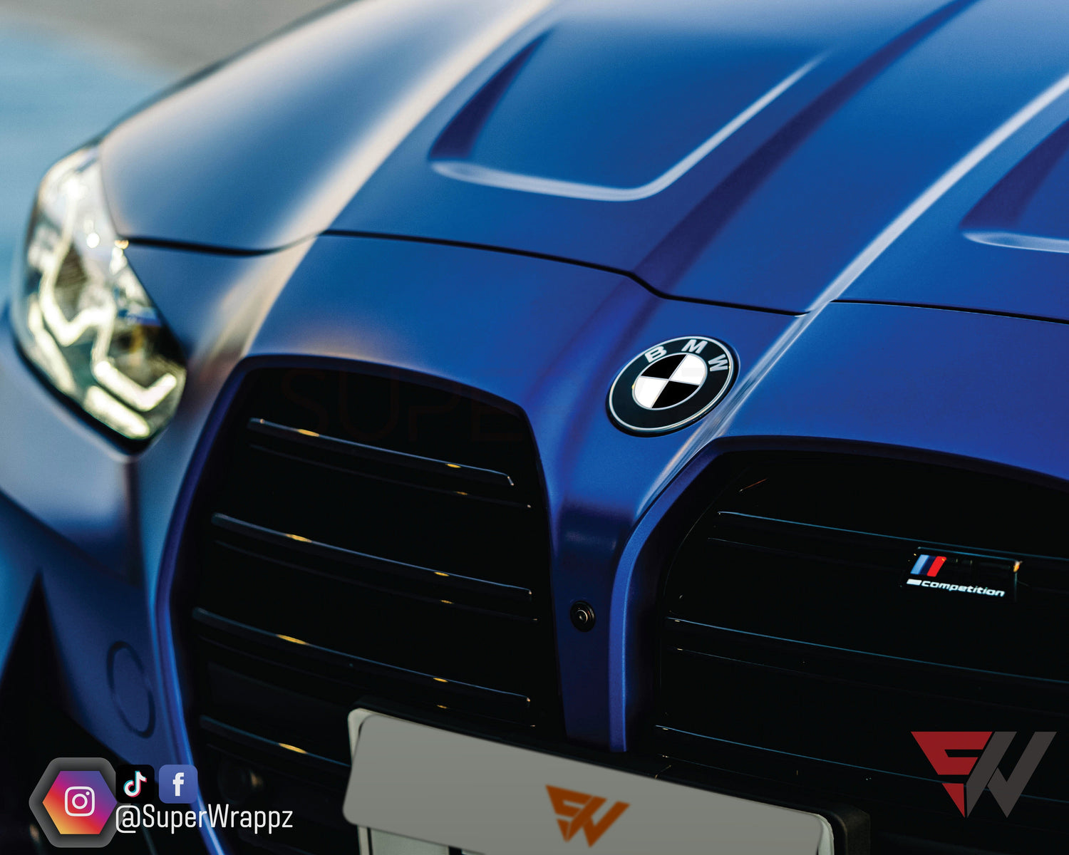 Black and White Gloss V2 BMW badge overlay by SuperWrappz for F40/G20/G30 2017-plus BMWs, aftermarket cast vinyl