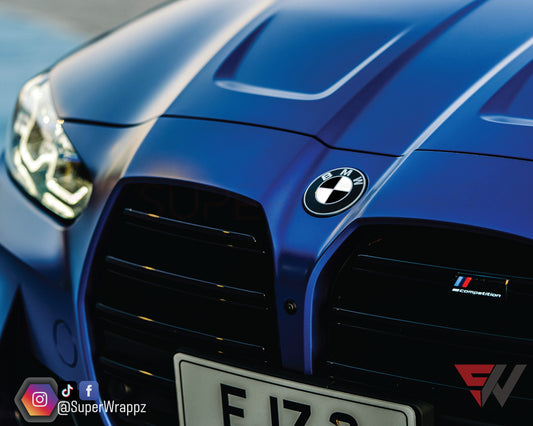 Half Black Gloss V2 BMW badge overlay by SuperWrappz for F40/G20/G30 2017-plus BMWs, aftermarket cast vinyl