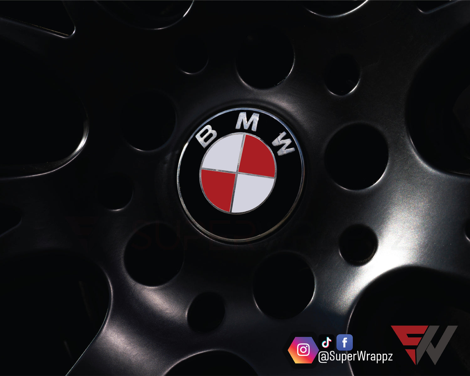 England & Canada Flag BMW badge overlay on an alloy wheel centre cap, close-up