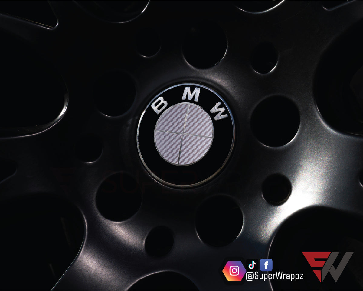 Full Silver Carbon BMW badge overlay applied to an alloy wheel centre cap, close-up