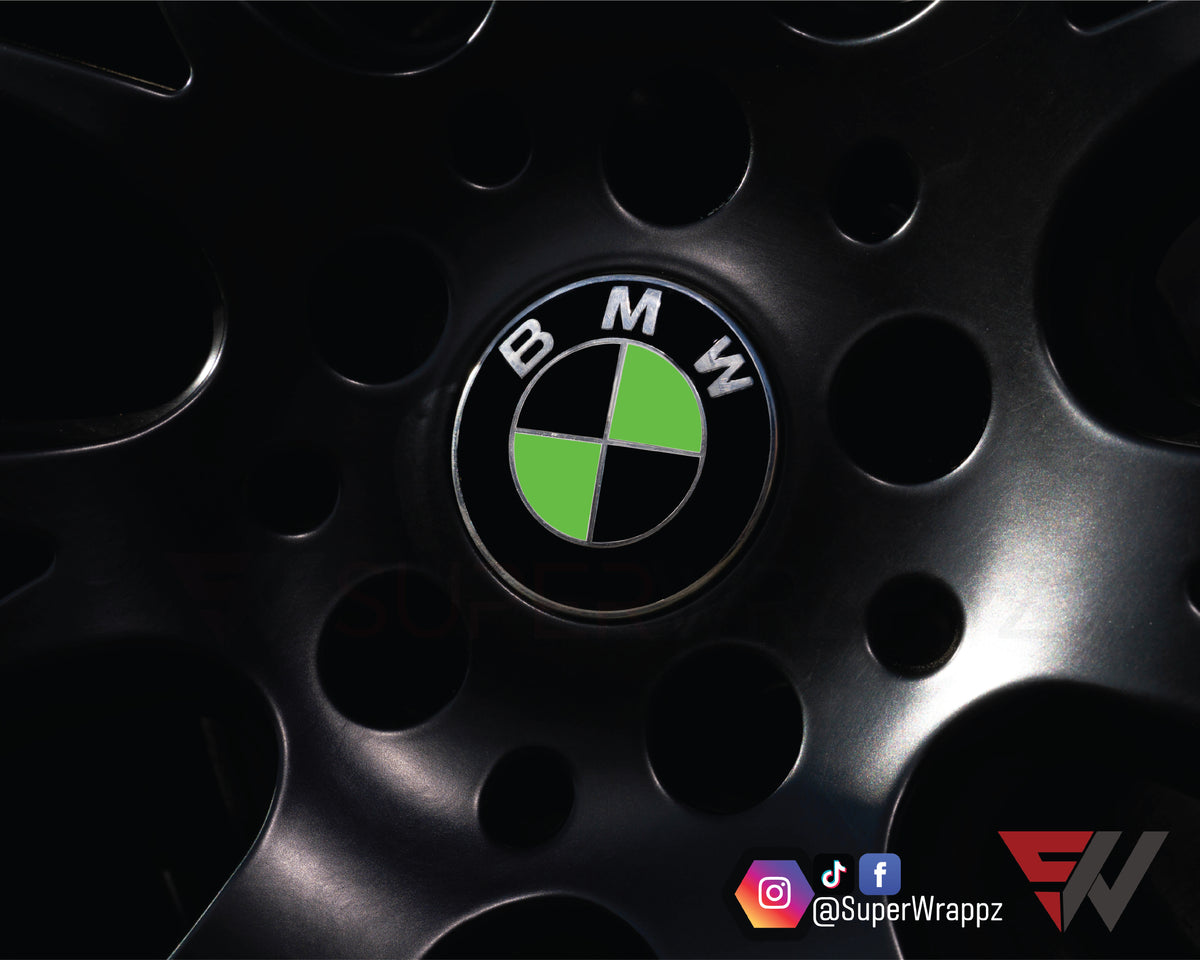 Black & Green Gloss BMW badge overlay applied to an alloy wheel centre cap, close-up