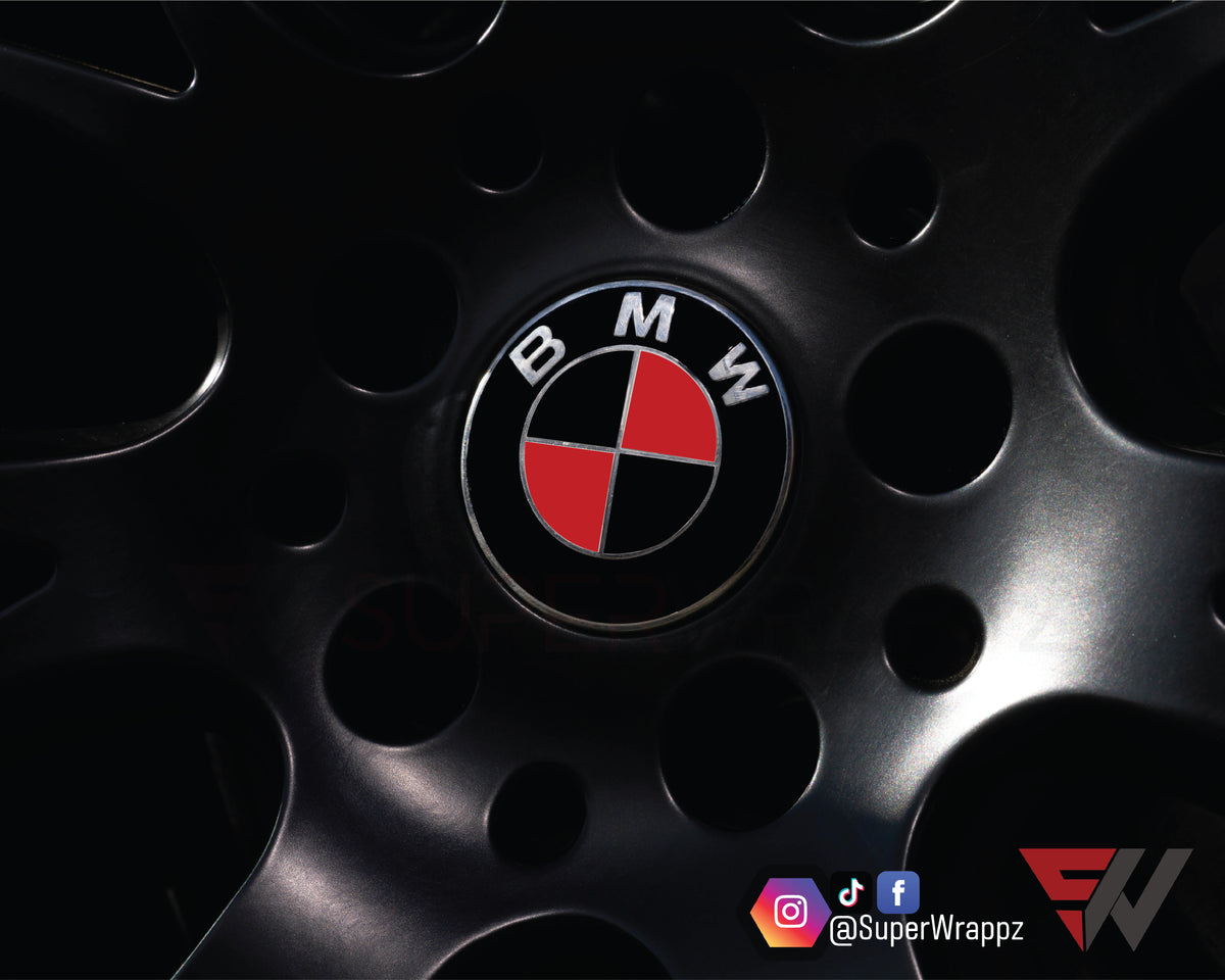 Black & Red Gloss BMW badge overlay applied to the front hood badge, close-up