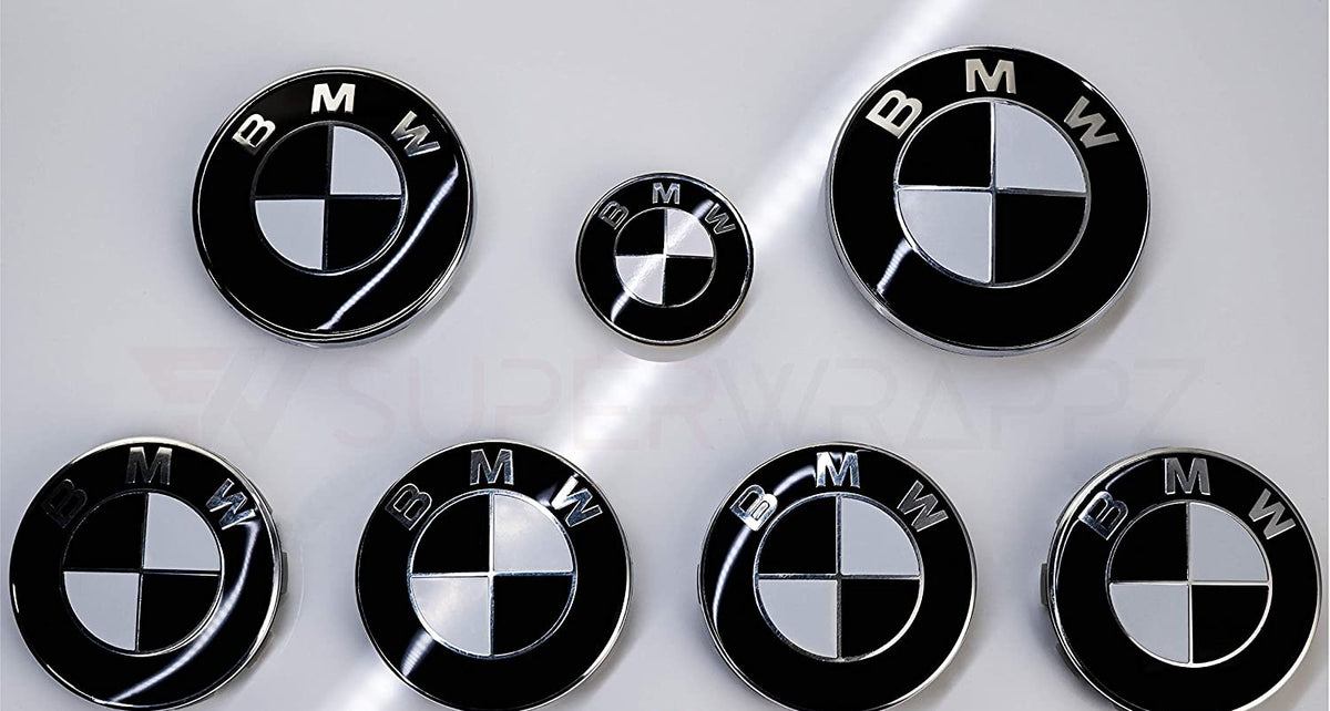 Half Black Gloss BMW badge overlay by SuperWrappz on E/F Series emblems, aftermarket cast-vinyl set