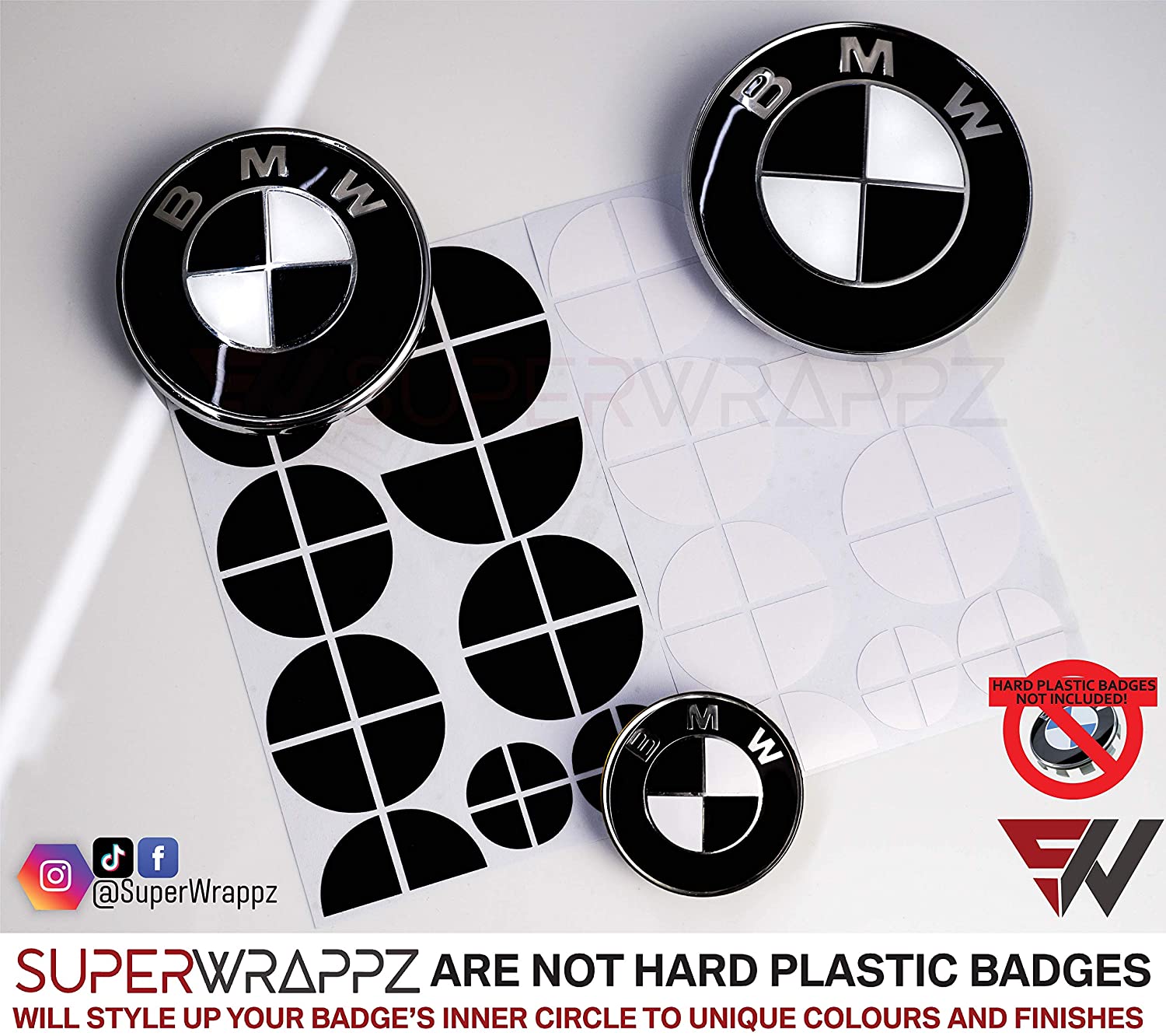 Black and White Gloss BMW badge overlay by SuperWrappz on E/F Series emblems, aftermarket cast-vinyl set
