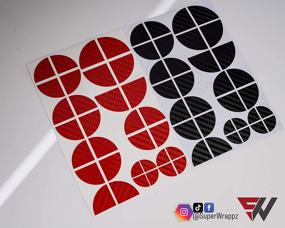 Black & Red Carbon BMW badge overlay, shown uncut on its adhesive backing sheet before application