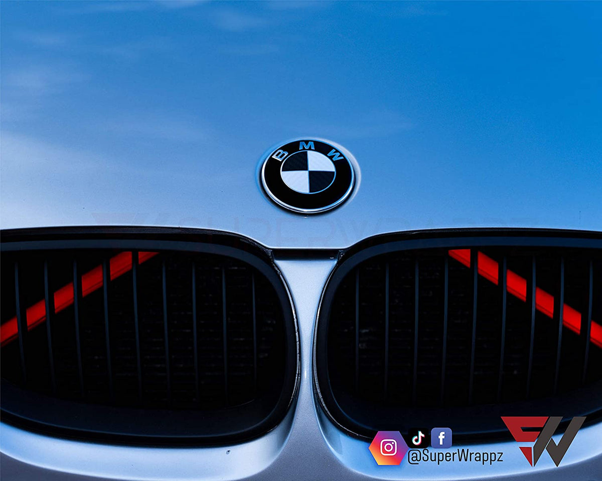 Black & White Carbon BMW badge overlay applied to the front hood badge, close-up
