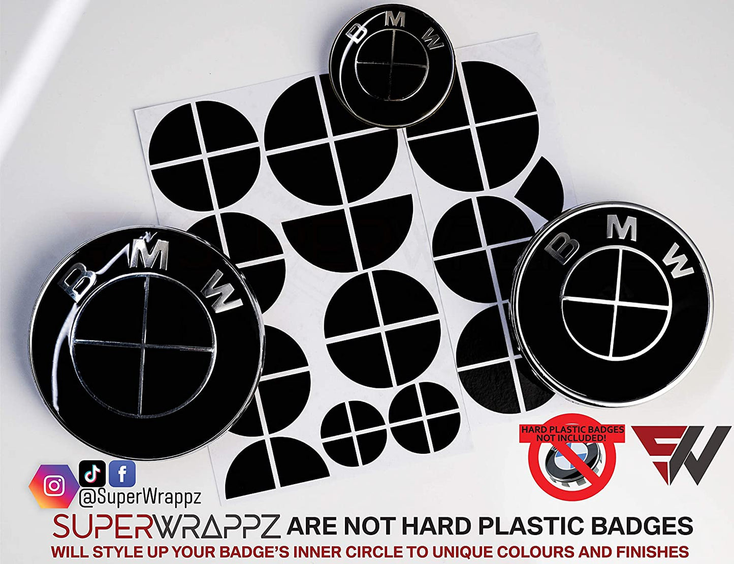 Full Black Gloss BMW badge overlay by SuperWrappz on E/F Series emblems, aftermarket cast-vinyl set