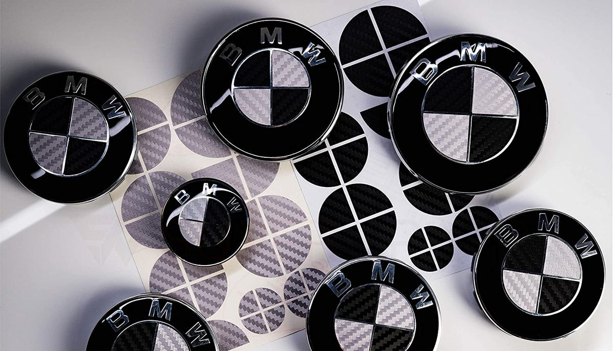 Black & Silver Carbon BMW badge overlay, complete badge set laid out on a plain background