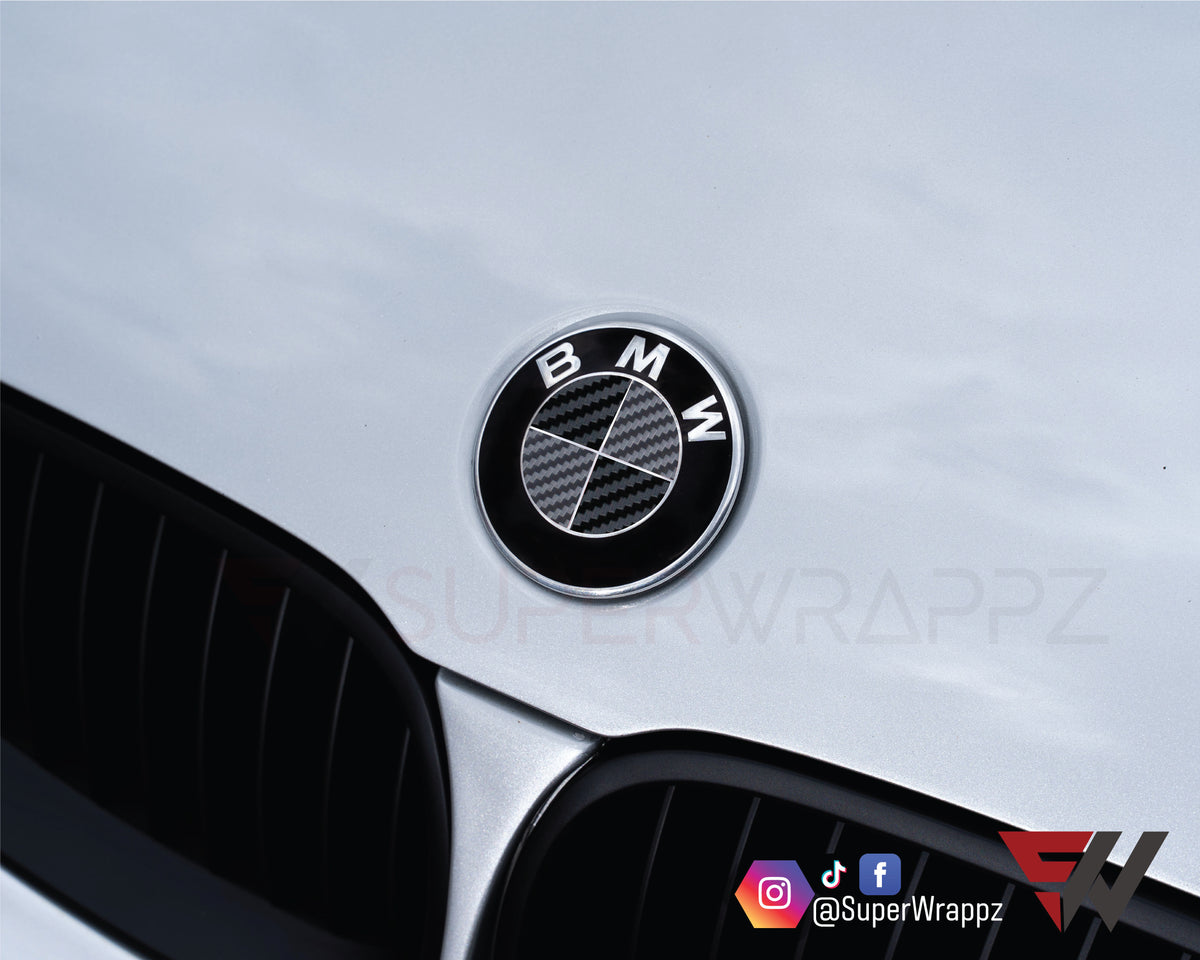 Black & Anthracite Carbon BMW badge overlay applied to the front hood badge, close-up