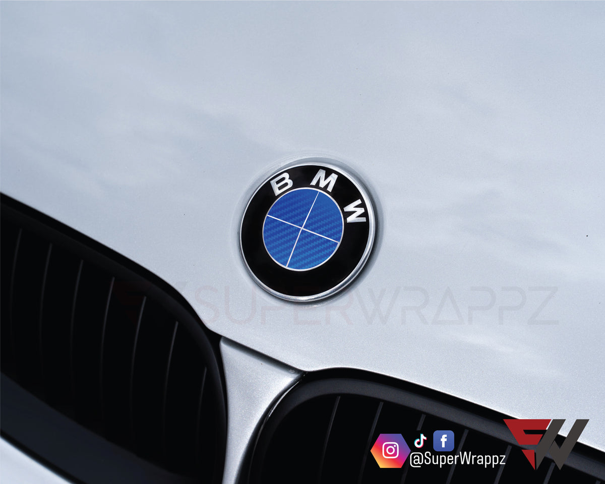 Full Blue Carbon BMW badge overlay applied to the front hood badge, close-up