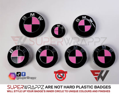 Pink and Black Gloss BMW badge overlay by SuperWrappz on E/F Series emblems, aftermarket cast-vinyl set