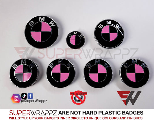 Pink and Black Gloss BMW badge overlay by SuperWrappz on E/F Series emblems, aftermarket cast-vinyl set