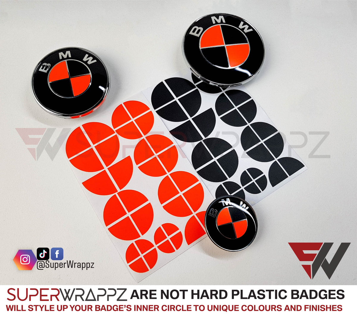 Fluorescent Red and Black Gloss BMW badge overlay by SuperWrappz on E/F Series emblems, aftermarket cast-vinyl set