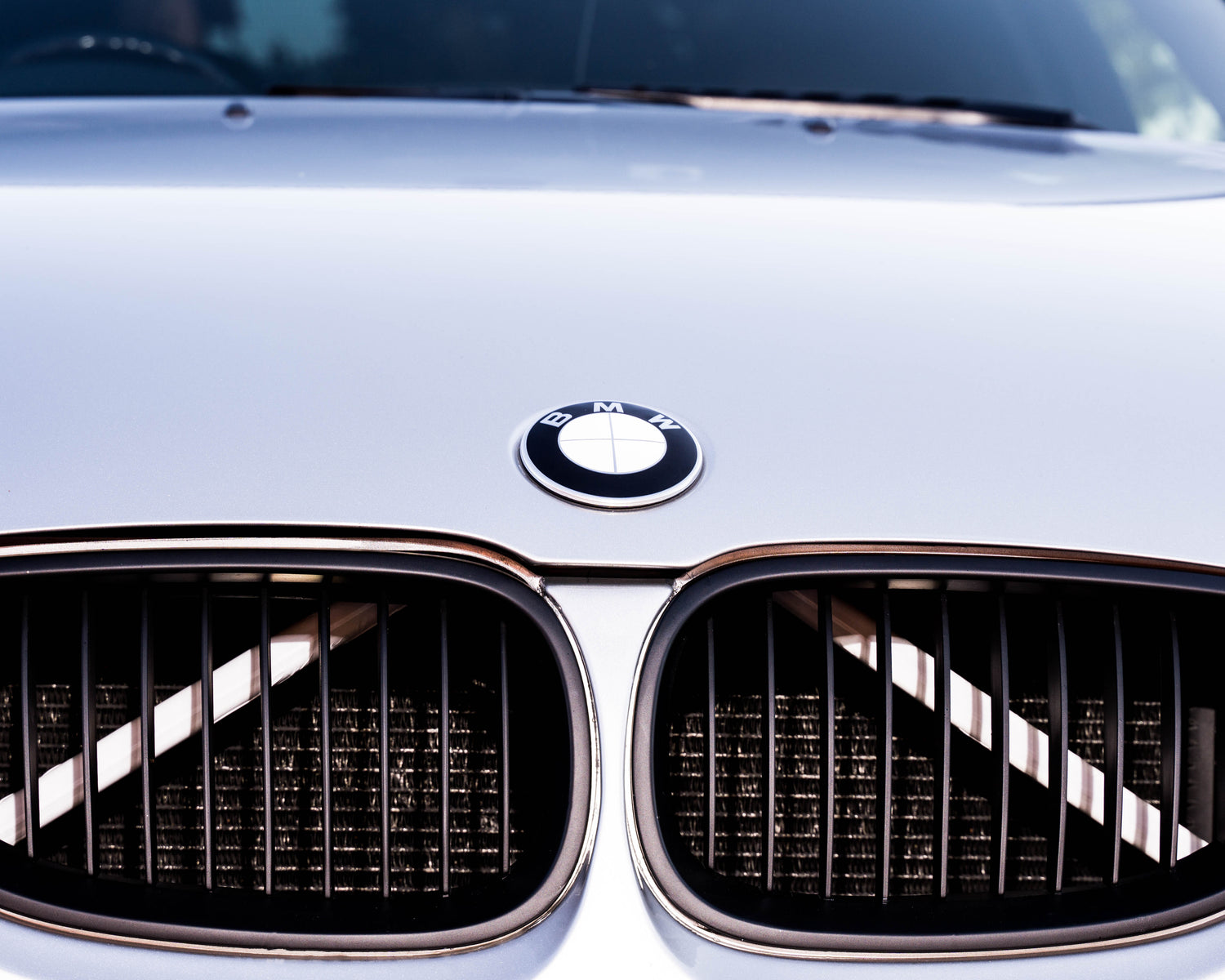 White reflective V-brace and crash-bar vinyl overlay for BMW by SuperWrappz, aftermarket