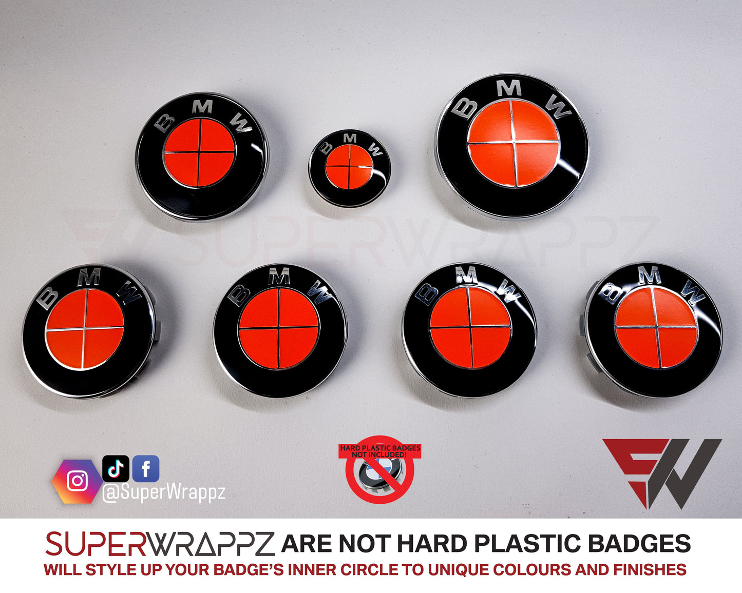 Full Red Fluorescent BMW badge overlay by SuperWrappz on E/F Series emblems, aftermarket cast-vinyl set