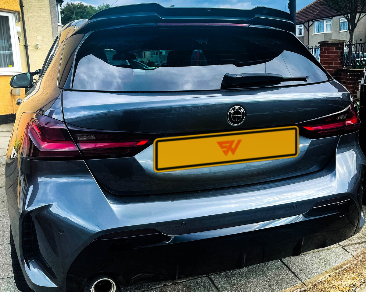 Full Black Gloss V2 BMW badge overlay by SuperWrappz for F40/G20/G30 2017-plus BMWs, aftermarket cast vinyl