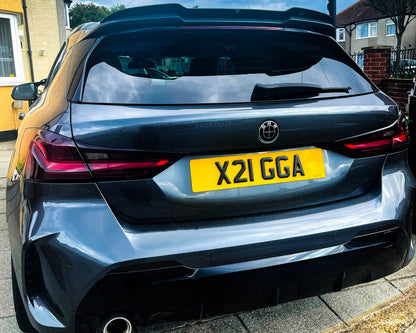 Full Black Gloss V2 BMW badge overlay by SuperWrappz for F40/G20/G30 2017-plus BMWs, aftermarket cast vinyl