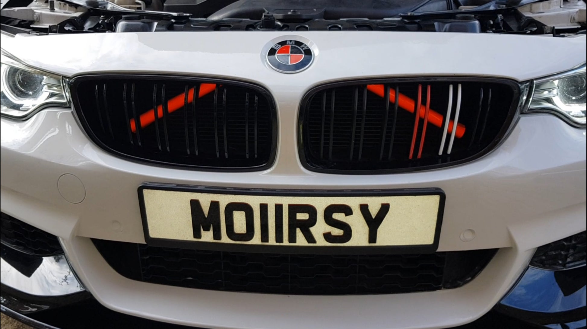 Showcasing the Red Luminescent crash bars set on a 4 series convertible