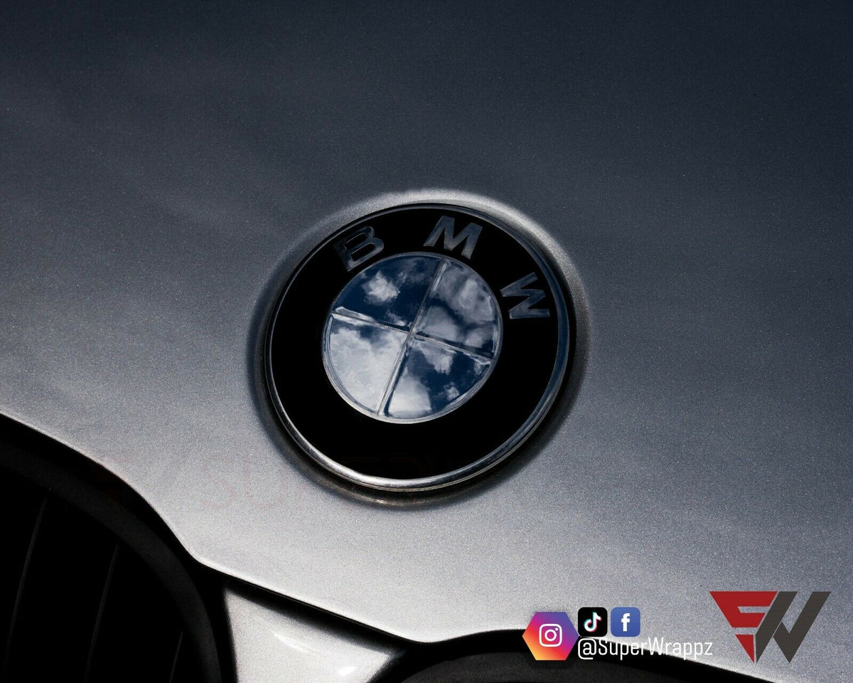 Chrome Silver Mirror BMW badge overlay applied to the front hood badge, close-up
