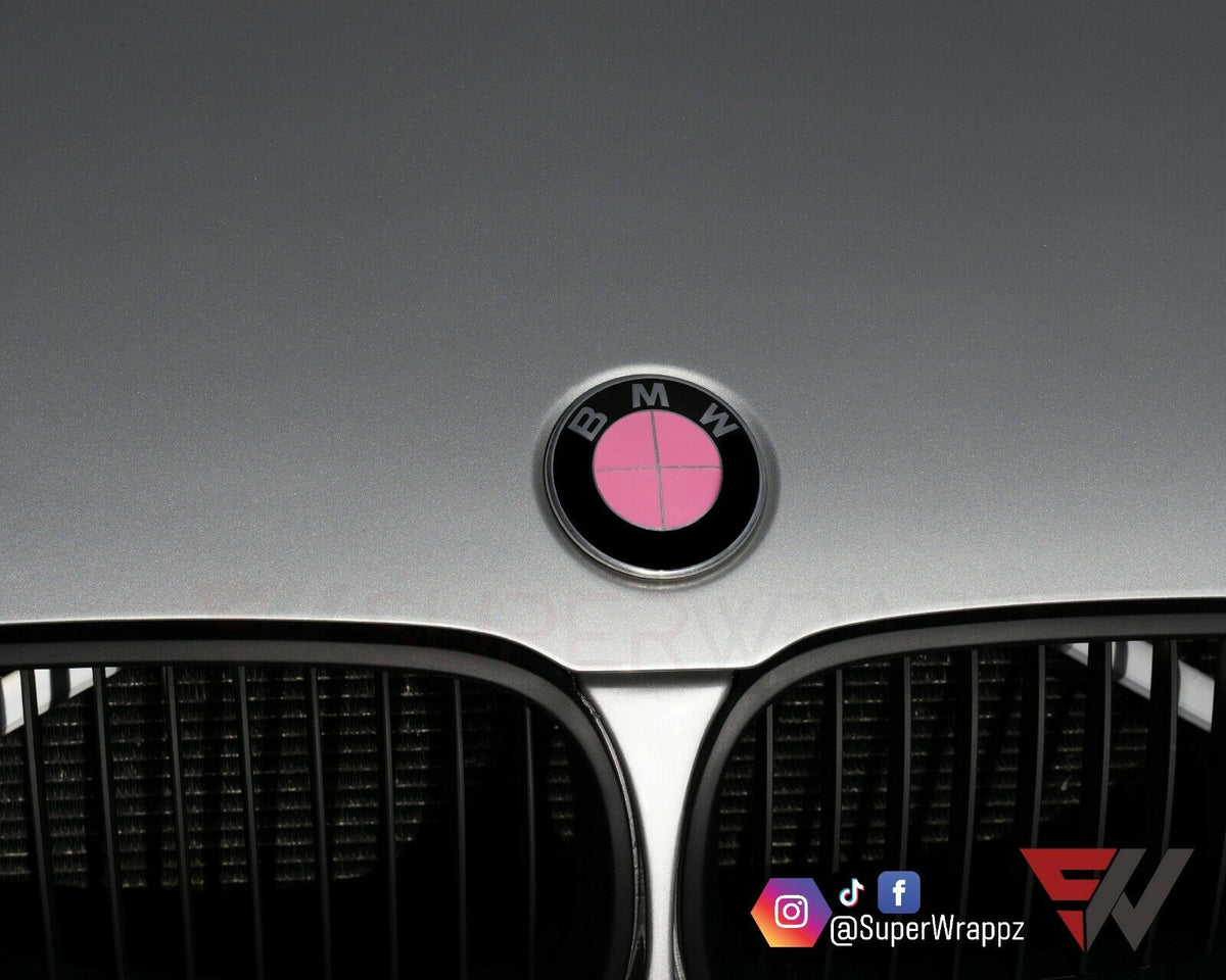 Full Pink Gloss BMW badge overlay applied to the front hood badge, close-up