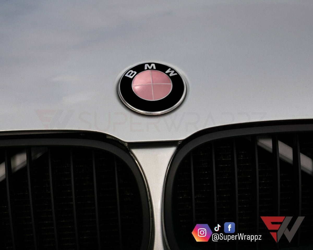 Chrome Rose Gold BMW badge overlay applied to the front hood badge, close-up