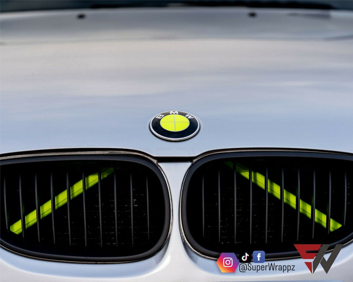 Full Green Fluorescent BMW badge overlay applied to the front hood badge, close-up