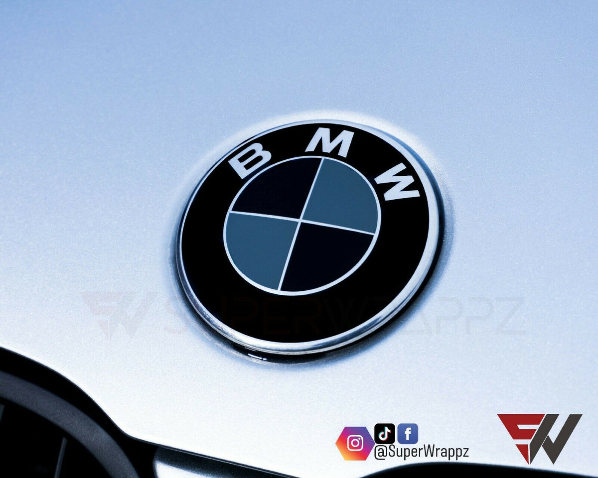 Black & Dark Grey Gloss BMW badge overlay applied to the front hood badge, close-up